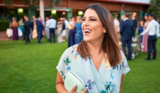 Closeup of wedding guest smiling
