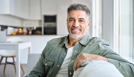 Closeup of man smiling while relaxing at home