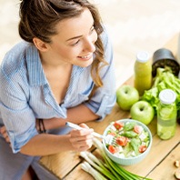 Patient eating healthy meal with calcium-rich foods
